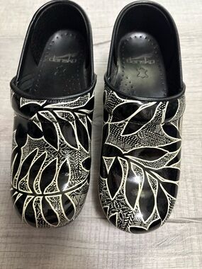 Dansko Black & White Leaf-Print Clogs